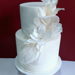 White Wedding cake with rice paper and wafer paper sails.