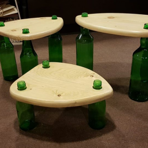 Upcycled pellet wood tables with bottles as legs. Ideal for side tables.